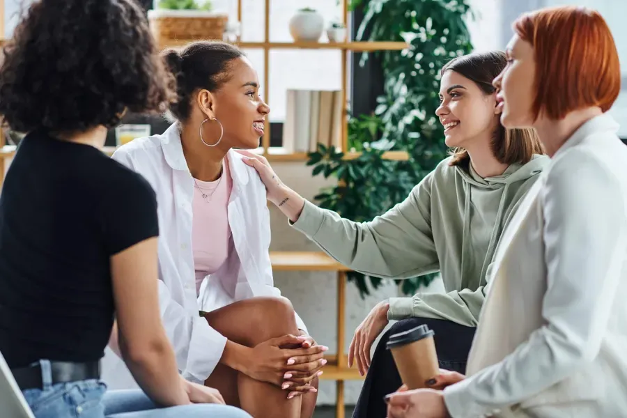 Team members in conversation around a table